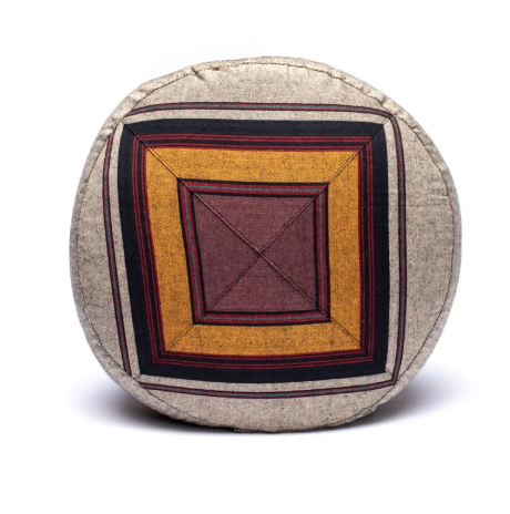Ochre and burgundy meditation cushion with geometric patterns