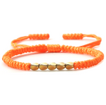 bracelet tibétain porte bonheur orné de perles de cuivre orange - univers tibet